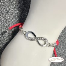 Zsinóros karkötő kristályos végtelen díszítéssel, csúszózárral -piros, ezüsttel